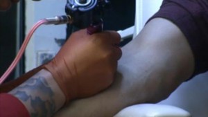 -- Mark het tatoeëeren bewerkt